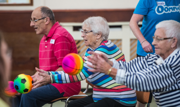 Older people take part in Oomph 'chairobics' class